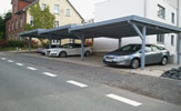 Reihen-Carports, Dacheindeckung mit Solux-Trapezplatten, Kopfbände und BSH-Leimholz – in Lemgo